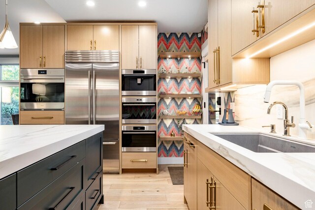 4746 Old Meadow Ln, Park City, UT 84098 - kitchen featuring built in refrigerator, light stone countertops, light wood-style floors, light brown cabinets, and recessed lighting