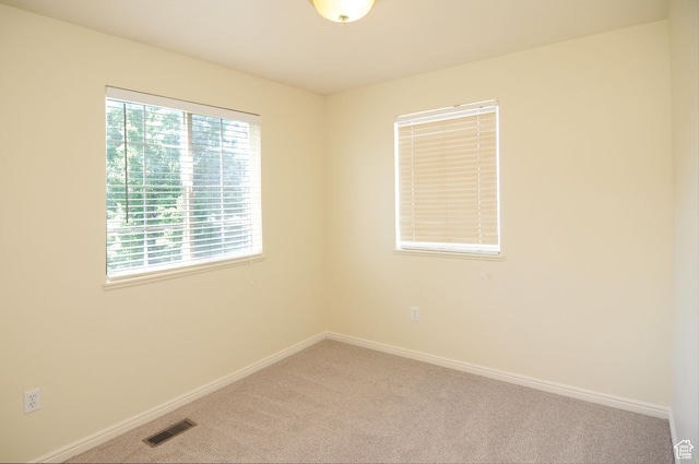 1511 W Leonardo Ln Unit D, West Valley City, UT 84119 - empty room with carpet floors and baseboards