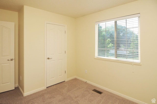 1511 W Leonardo Ln Unit D, West Valley City, UT 84119 - unfurnished bedroom featuring carpet flooring and baseboards