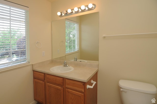 1511 W Leonardo Ln Unit D, West Valley City, UT 84119 - bathroom featuring vanity and plenty of natural light