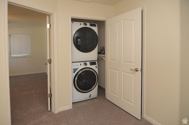 1511 W Leonardo Ln Unit D, West Valley City, UT 84119 - washroom with stacked washer / dryer and carpet flooring