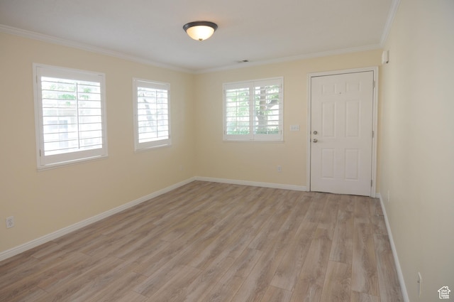 1511 W Leonardo Ln Unit D, West Valley City, UT 84119 - entrance foyer featuring light wood-style flooring and crown molding