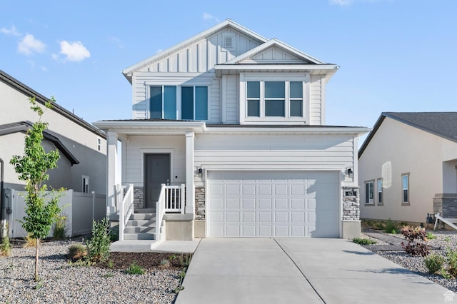 421 W Domain Ln, Grantsville, UT 84029 - view of front facade with a garage, driveway, stone siding, and board and batten siding