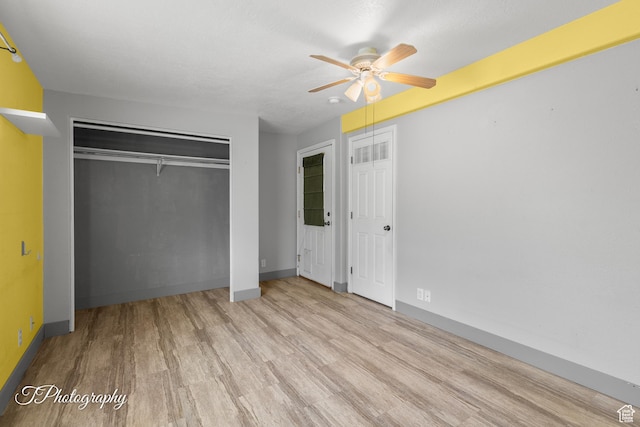 1160 E Telegraph Unit 227, Washington, UT 84780 - unfurnished bedroom featuring wood finished floors, multiple closets, and ceiling fan