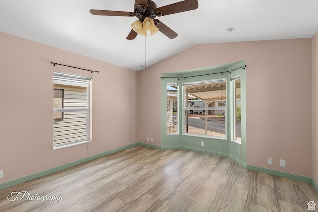 1160 E Telegraph Unit 227, Washington, UT 84780 - spare room featuring wood finished floors, lofted ceiling, a ceiling fan, and a smoke detector