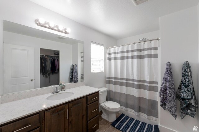 721 S 110 W, Spanish Fork, UT 84660 - full bathroom with vanity, tile patterned floors, a shower with shower curtain, and a spacious closet
