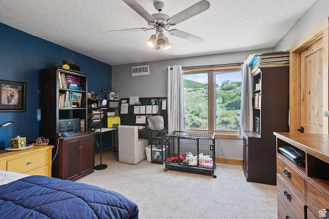 9506 Silver Creek Rd, Park City, UT 84098 - bedroom with light carpet, a textured ceiling, a desk, and a ceiling fan