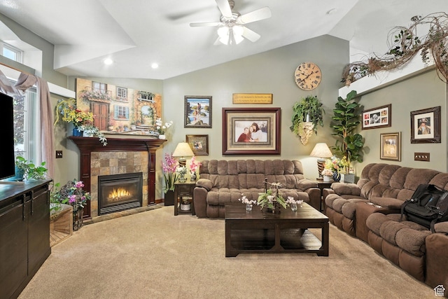 1680 N Camelot Dr E, North Logan, UT 84341 - carpeted living area with vaulted ceiling, ceiling fan, a tiled fireplace, and recessed lighting