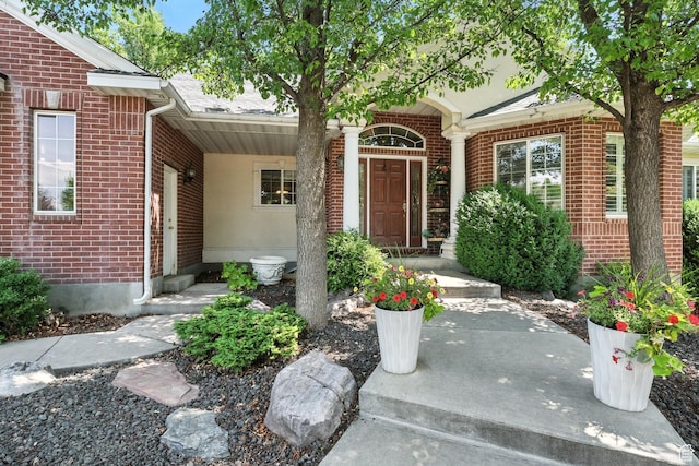 1680 N Camelot Dr E, North Logan, UT 84341 - doorway to property featuring brick siding