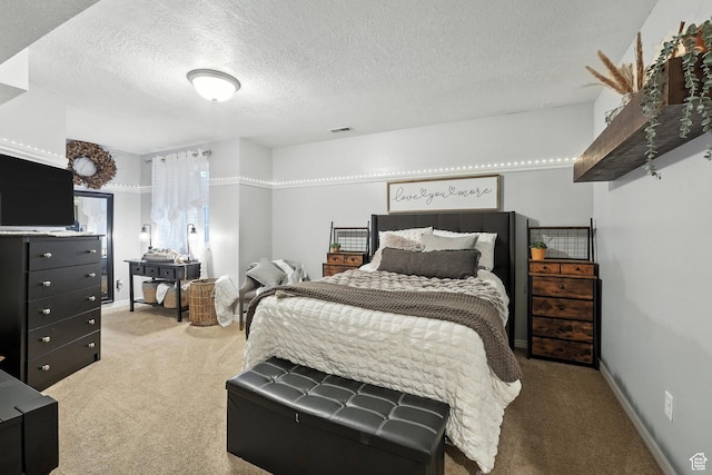 1680 N Camelot Dr E, North Logan, UT 84341 - carpeted bedroom featuring a textured ceiling
