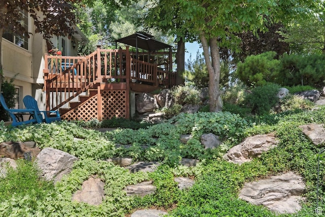 1680 N Camelot Dr E, North Logan, UT 84341 - view of yard featuring a deck and stairs