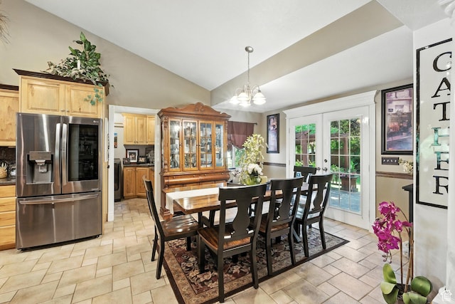 1680 N Camelot Dr E, North Logan, UT 84341 - dining room with french doors, light stone finish flooring, a chandelier, washer / dryer, and high vaulted ceiling