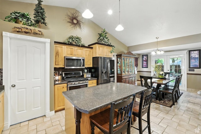 1680 N Camelot Dr E, North Logan, UT 84341 - kitchen featuring stainless steel appliances, dark countertops, high vaulted ceiling, light brown cabinetry, and light stone finish flooring