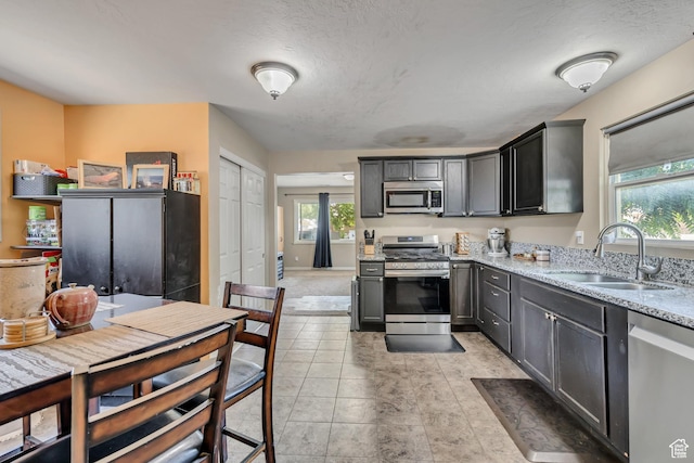 2752 S 9150 W, Magna, UT 84044 - kitchen featuring stainless steel appliances and light stone countertops