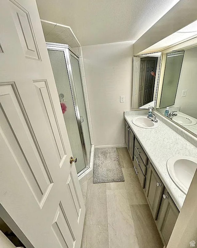650 S Main St Unit 6111, Bountiful, UT 84010 - bathroom featuring a shower stall and double vanity