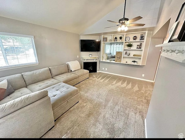 650 S Main St Unit 6111, Bountiful, UT 84010 - living room featuring ceiling fan, vaulted ceiling, a fireplace, and carpet flooring