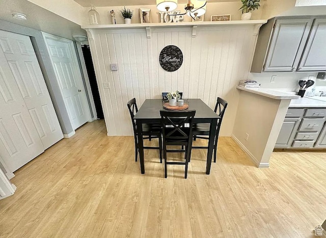 650 S Main St Unit 6111, Bountiful, UT 84010 - dining room with light wood-type flooring and a chandelier
