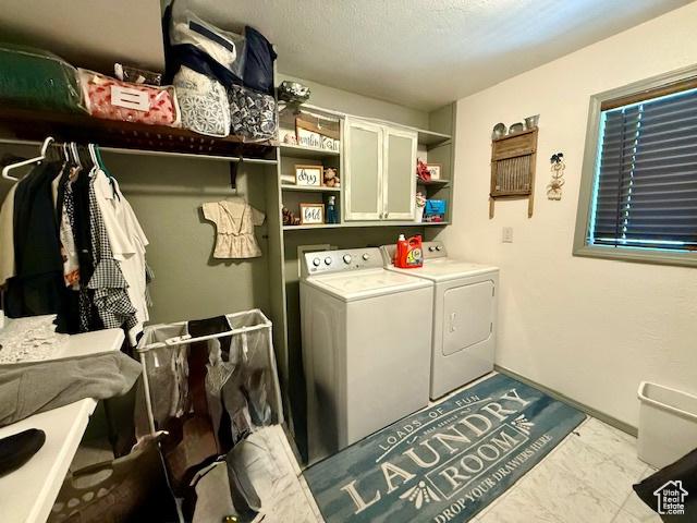 536 N Sundance Cir, Vernal, UT 84078 - laundry area featuring washer and clothes dryer, cabinet space, and marble finish floors