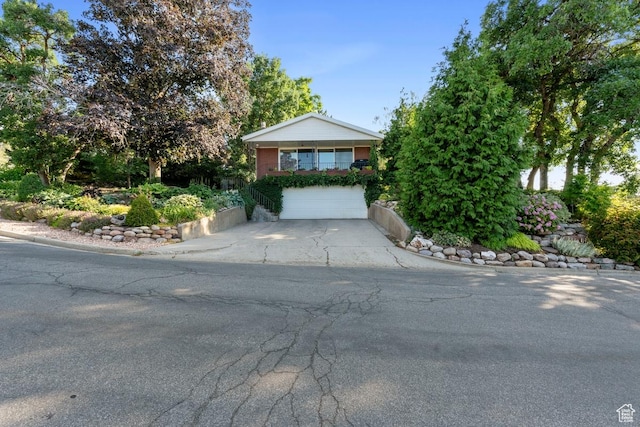 2793 S Davis Blvd, Bountiful, UT 84010 - obstructed view of property with concrete driveway and an attached garage