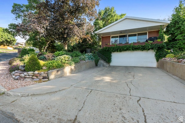 2793 S Davis Blvd, Bountiful, UT 84010 - view of front of house with brick siding, driveway, and a garage