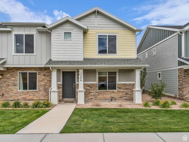1206 W Summit Ridge Pkwy S Unit 182, Santaquin, UT 84655 - view of front of property with a front lawn, stone siding, a shingled roof, and board and batten siding