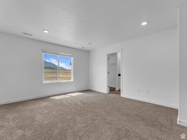 1206 W Summit Ridge Pkwy S Unit 182, Santaquin, UT 84655 - carpeted spare room featuring a textured ceiling and recessed lighting