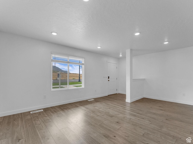 1206 W Summit Ridge Pkwy S Unit 182, Santaquin, UT 84655 - empty room with wood finished floors and recessed lighting