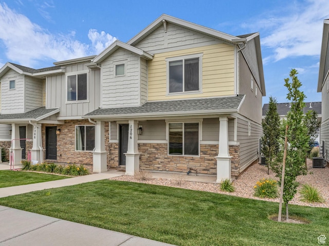 1206 W Summit Ridge Pkwy S Unit 182, Santaquin, UT 84655 - view of front of home with stone siding, a front yard, board and batten siding, and roof with shingles