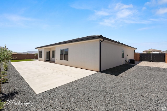 1516 E Mountain Trl, St George, UT 84790 - back of house featuring a fenced backyard, a patio, and stucco siding