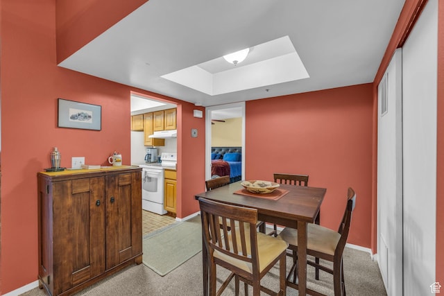 7065 N 2200 W Unit 2E, Park City, UT 84098 - dining area featuring a tray ceiling, a skylight, and light carpet