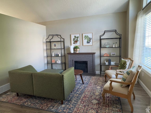 1216 N 2725 W, Layton, UT 84041 - sitting room with a brick fireplace, wood finished floors, and a textured ceiling