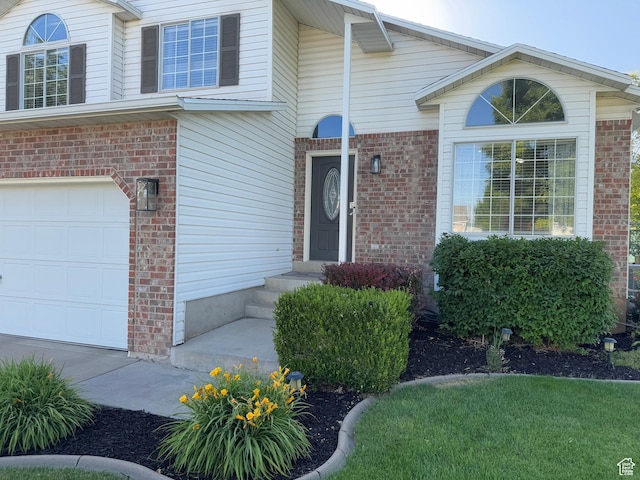 1216 N 2725 W, Layton, UT 84041 - entrance to property featuring a garage and brick siding