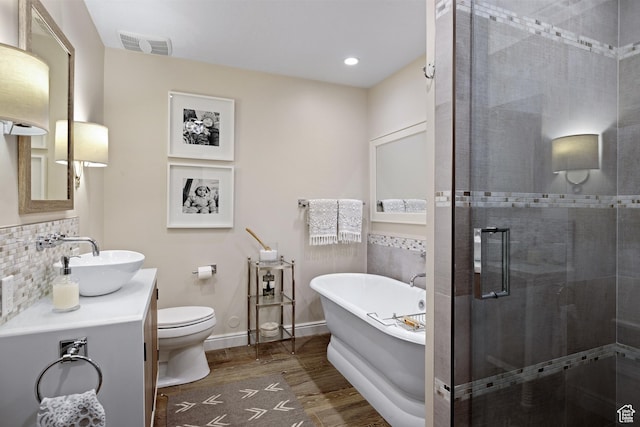 3605 W Wrangler Way, Park City, UT 84098 - full bath with wood finished floors, a soaking tub, a shower stall, vanity, and decorative backsplash