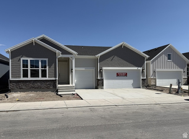 258 E Polaris Dr Unit 110, Saratoga Springs, UT 84045 - craftsman-style house with a garage, stone siding, driveway, and board and batten siding