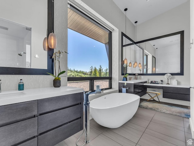 4693 Pinnacle Sky Loop, Park City, UT 84098 - bathroom with vanity, a freestanding bath, and tile patterned flooring