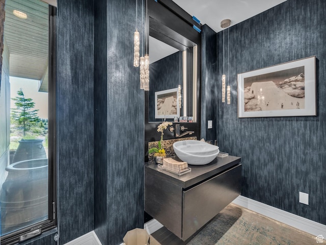 4693 Pinnacle Sky Loop, Park City, UT 84098 - bathroom with vanity, wallpapered walls, and wood finished floors