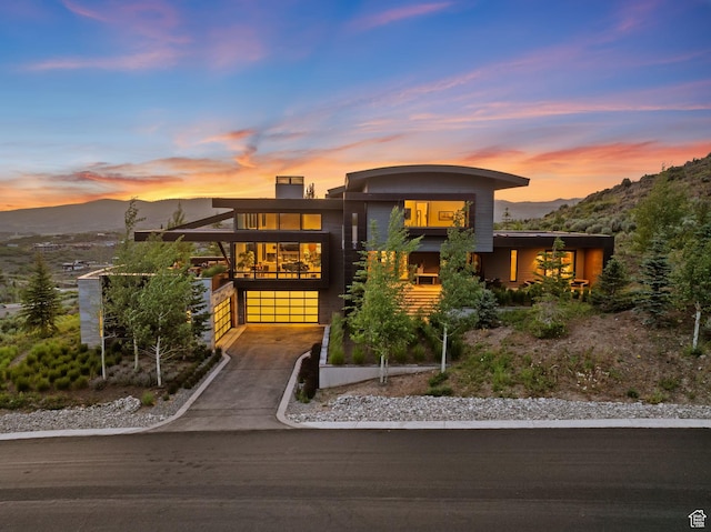 4693 Pinnacle Sky Loop, Park City, UT 84098 - modern home featuring a mountain view, driveway, and a garage