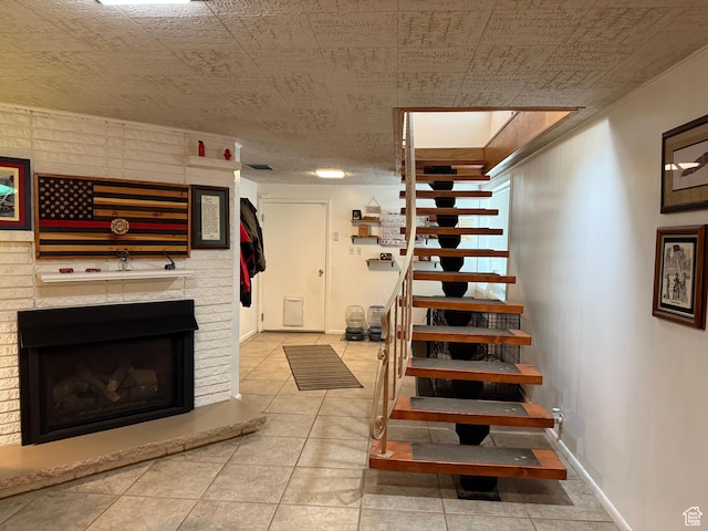 2936 E Ln Joya Dr S, Holladay, UT 84124 - stairs featuring tile patterned flooring and a brick fireplace