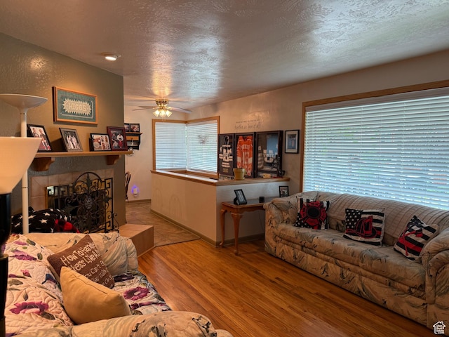 2936 E Ln Joya Dr S, Holladay, UT 84124 - living room with wood finished floors, a ceiling fan, and a textured ceiling