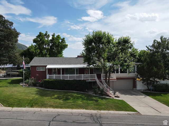 2936 E Ln Joya Dr S, Holladay, UT 84124 - single story home featuring concrete driveway, a front yard, an attached garage, stairway, and a porch