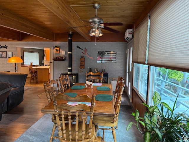 2936 E Ln Joya Dr S, Holladay, UT 84124 - dining area featuring brick wall, a wood stove, a wood ceiling with exposed beams, ceiling fan, and wood finished floors