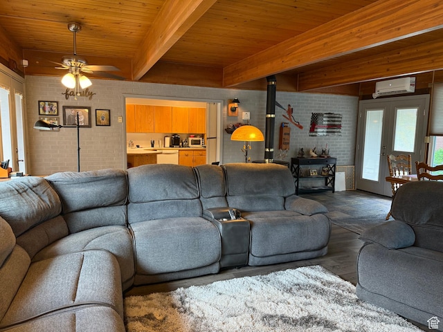 2936 E Ln Joya Dr S, Holladay, UT 84124 - living room featuring a wood stove, brick wall, a wall mounted air conditioner, wood finished floors, and a ceiling fan
