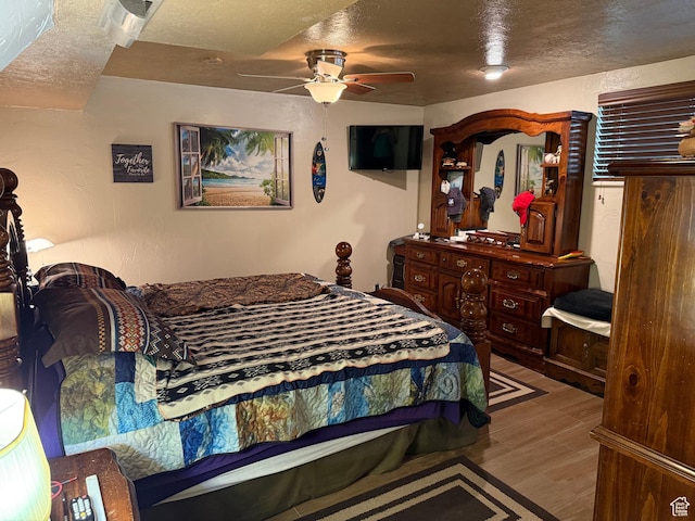 2936 E Ln Joya Dr S, Holladay, UT 84124 - bedroom featuring a textured ceiling, wood finished floors, and a ceiling fan