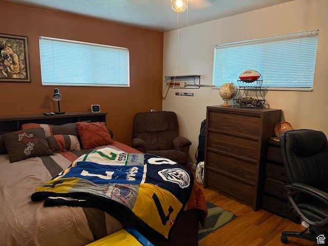 2936 E Ln Joya Dr S, Holladay, UT 84124 - bedroom with wood finished floors and multiple windows