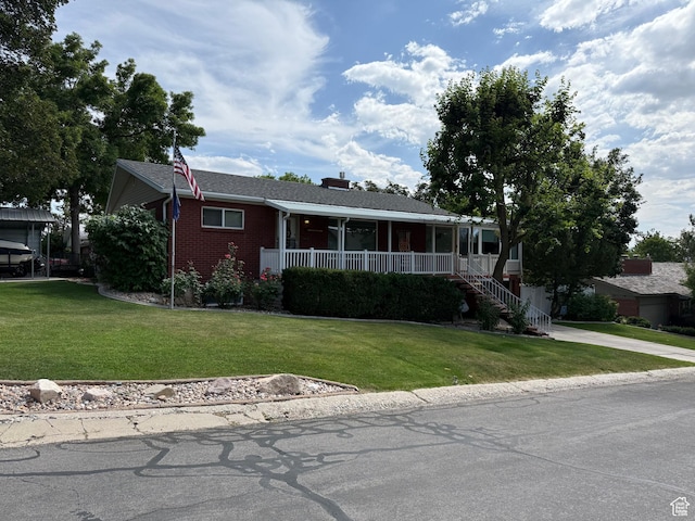 2936 E Ln Joya Dr S, Holladay, UT 84124 - ranch-style home featuring a porch, a front yard, brick siding, stairs, and concrete driveway