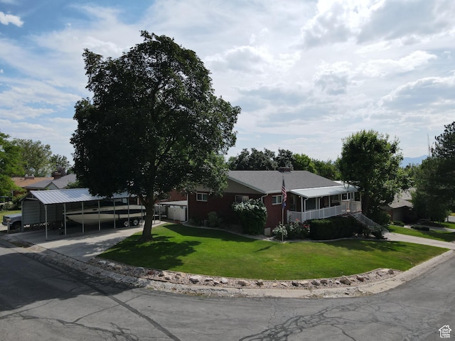 2936 E Ln Joya Dr S, Holladay, UT 84124 - ranch-style house featuring a front lawn and a carport