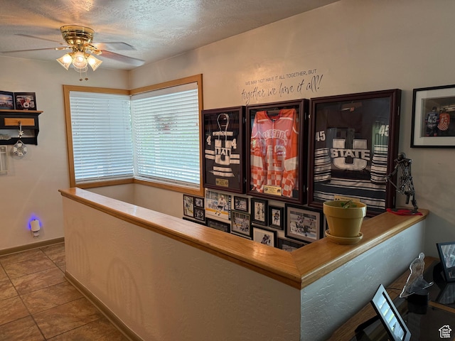2936 E Ln Joya Dr S, Holladay, UT 84124 - bar featuring ceiling fan, tile patterned floors, and a textured ceiling
