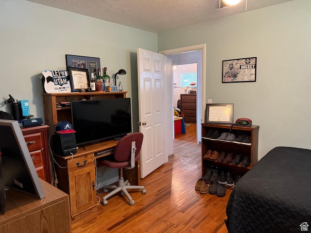 2936 E Ln Joya Dr S, Holladay, UT 84124 - bedroom featuring light wood-style flooring and a desk