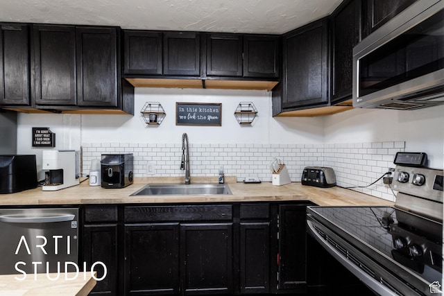 4370 S 175 E, Washington Terrace, UT 84405 - kitchen with stainless steel appliances and dark cabinetry