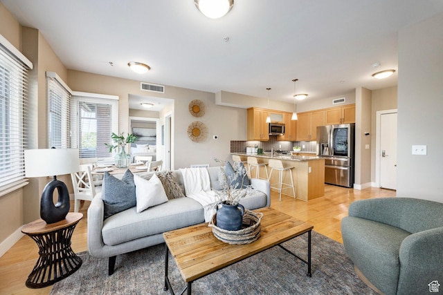1988 S 1100 E Unit 308, Salt Lake City, UT 84105 - living area with light wood-style floors and baseboards